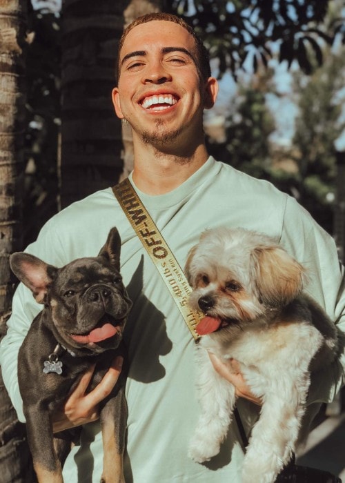 Landon McBroom with his dogs as seen in April 2018