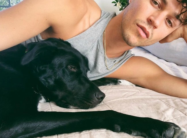 Miles McMillan in a selfie with his dog as seen in September 2019