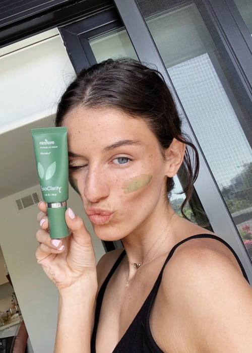 Olivia Rouyre promoting bioClarity in a selfie in August 2019