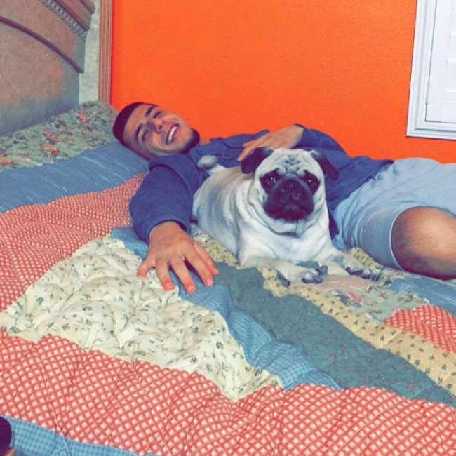 Brandon Awadis with his dog as seen in March 2018