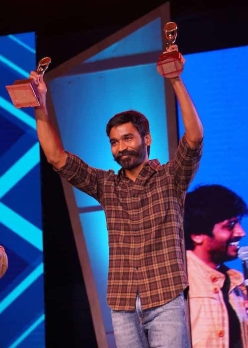 Dhanush as seen in a picture taken after being given the best actor award from Anna university Techofes awards in March 2019