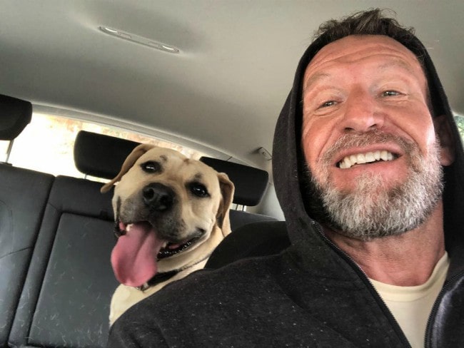 Dorian Yates in a selfie with his dog as seen in March 2019