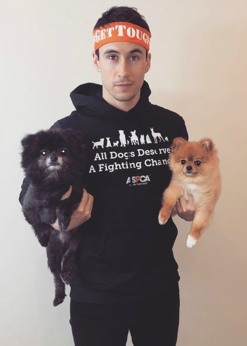 Huw Collins with his dogs as seen in April 2019