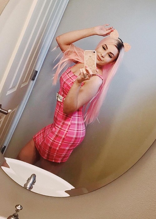 Leah Ashe as seen while taking a mirror selfie in July 2018