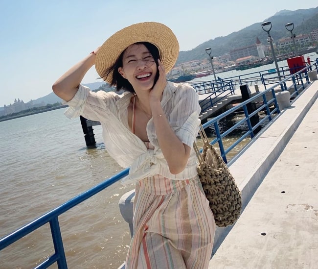 Lee Hyun-yi as seen while smiling for the camera at Ponte Cais De Coloane in Largo do Cais, Macao in October 2019