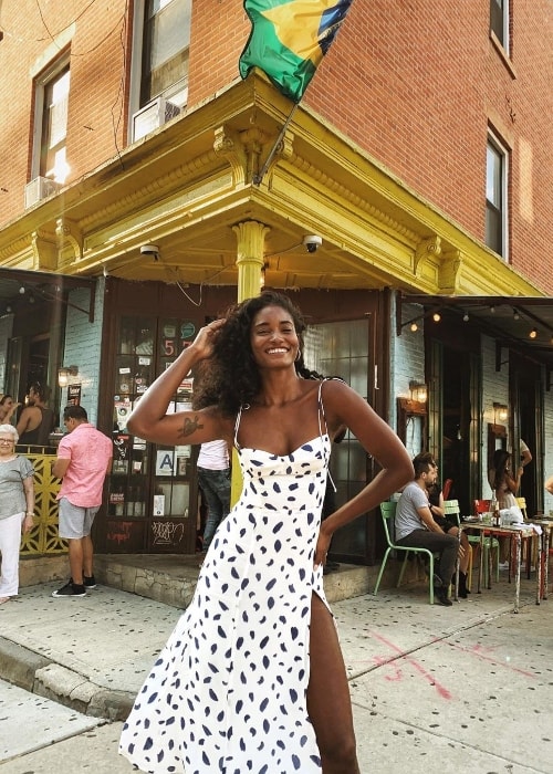 Melodie Monrose as seen while smiling for a picture at Miss Favela in Brooklyn, New York, United States in August 2019