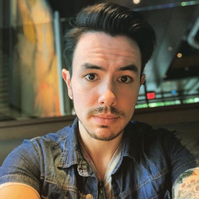 NateWantsToBattle in a selfie looking dapper in August 2019