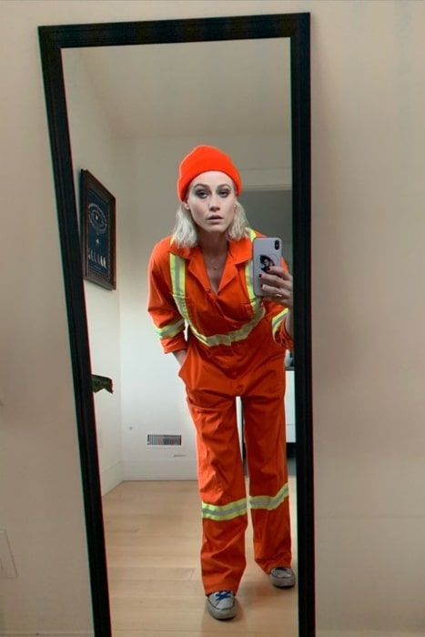 Olivia Taylor Dudley as seen while taking a mirror selfie wearing a construction worker jumpsuit in October 2019