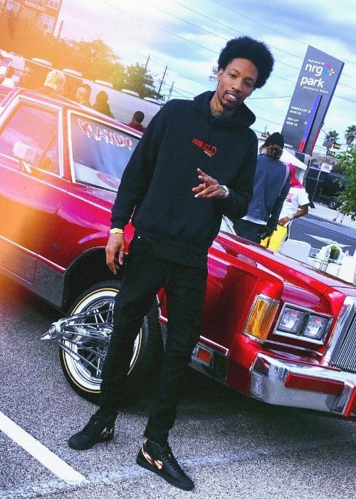 Sonny Digital as seen while posing for the camera showing his shoes in Houston, Texas, United States in November 2018