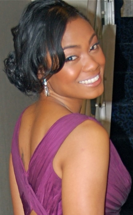 Tatyana Ali as seen while smiling in a picture at the Presidential Inauguration in 2009