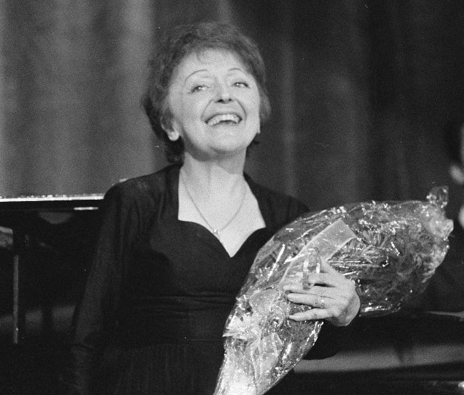 Édith Piaf as seen while smiling in a picture in December 1962
