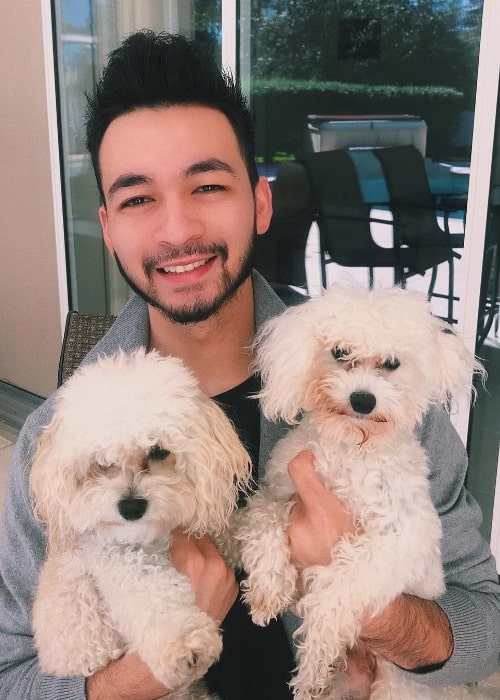 Alex Moy as seen in a picture with his adorable dogs in January 2019