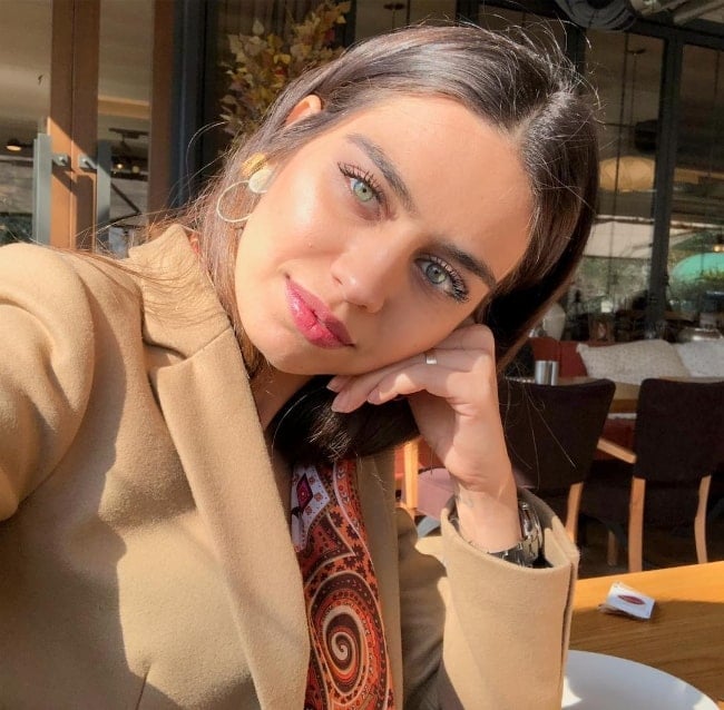Amine Gülşe as seen while taking a selfie in March 2019