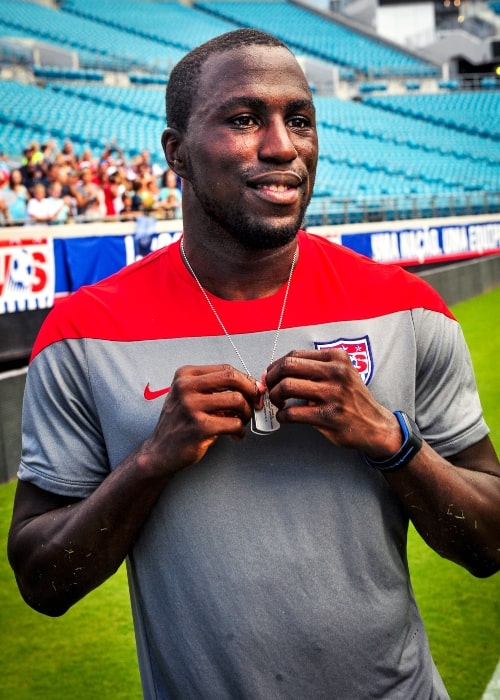 Jozy Altidore as seen in a picture taken while holding a custom 2014 World Cup dog tag that was presented to him at during an open-practice for fans at Everbank Stadium in June 2014