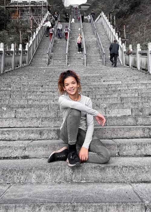 Rykel Bennett as seen while posing for a picture at Tianmen Mountain located within Tianmen Mountain National Park in China in November 2019