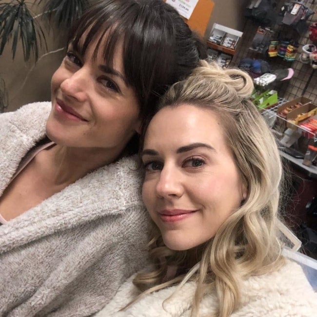 Sarah Butler (Left) as seen while posing for a picture along with Samantha Cope in December 2018