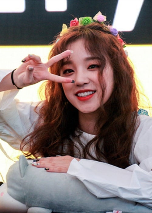 Song Yuqi as seen while smiling and posing for a picture during an event in June 2018