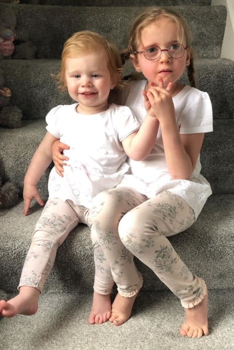 Sophie Conder as seen while sitting alongside her younger sister, Chloe, in May 2019