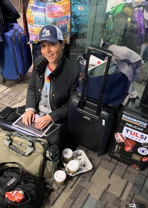 Tulsi Gabbard as seen in a picture while she sits on the floor of the Minneapolis-Saint Paul International Airport while waiting for a second flight to New Hampshire in November 2019