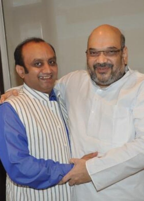 Amit Shah (Right) as seen while sharing a candid moment with politician Sudhanshu Trivedi in August 2017