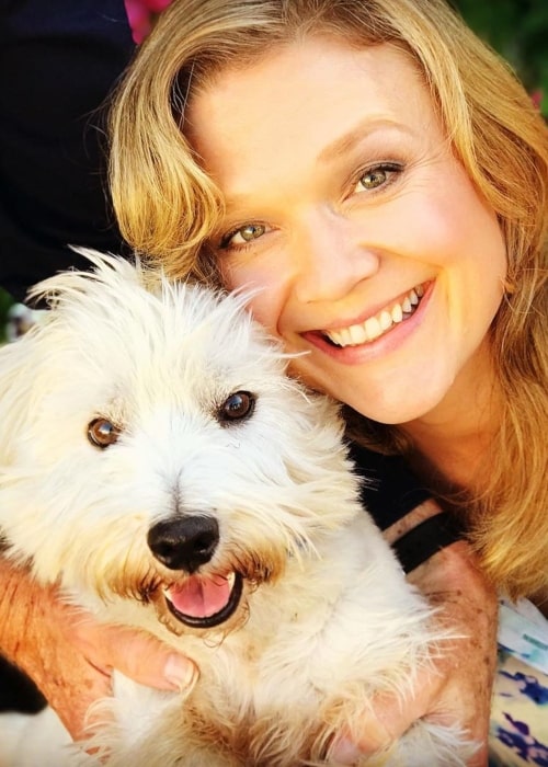 Ariana Richards as seen in a closeup picture taken with her dog Laddie in August 2019