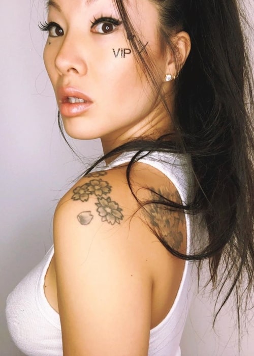 Asa Akira as seen in a closeup picture taken while flaunting her facial tattoo in August 2019