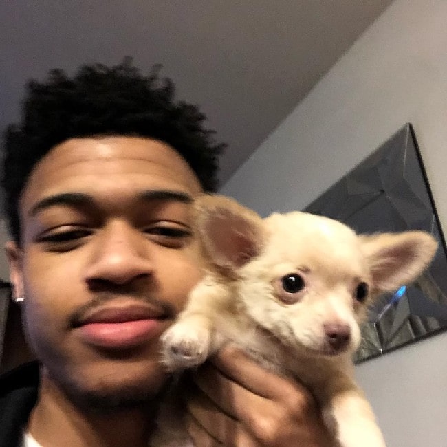 DopeIsland with his dog as seen in February 2019