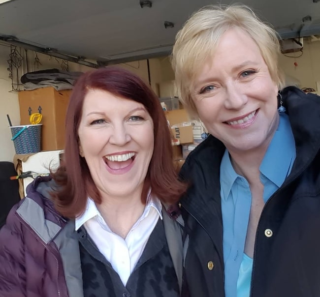 Eve Plumb (Right) as seen while smiling in a picture alongside Kate Flannery on the sets of 'A Very Brady Renovation' in January 2019