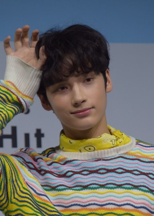 Huening Kai as seen while posing for the camera at Tomorrow X Together's debut showcase in March 2019