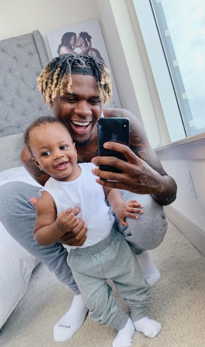 King Nique&King as seen while taking a mirror selfie with his son in May 2019