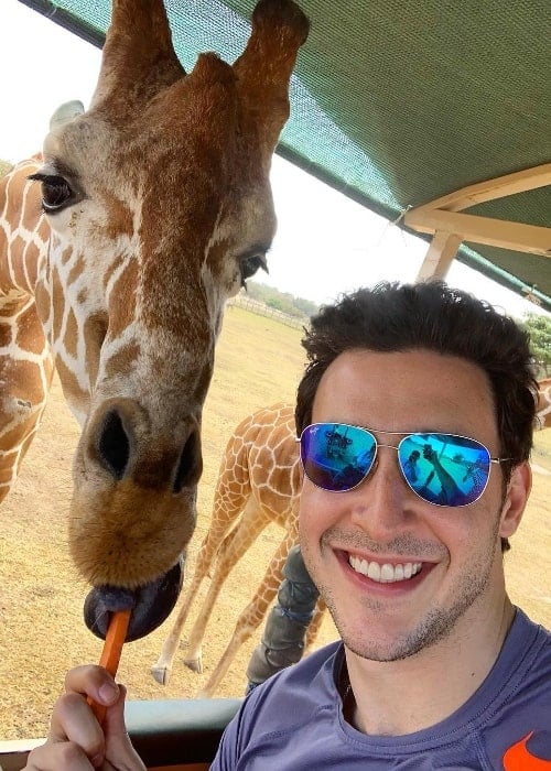Mikhail Varshavski as seen while clicking a selfie along with a giraffe during a safari in Costa Rica in January 2019