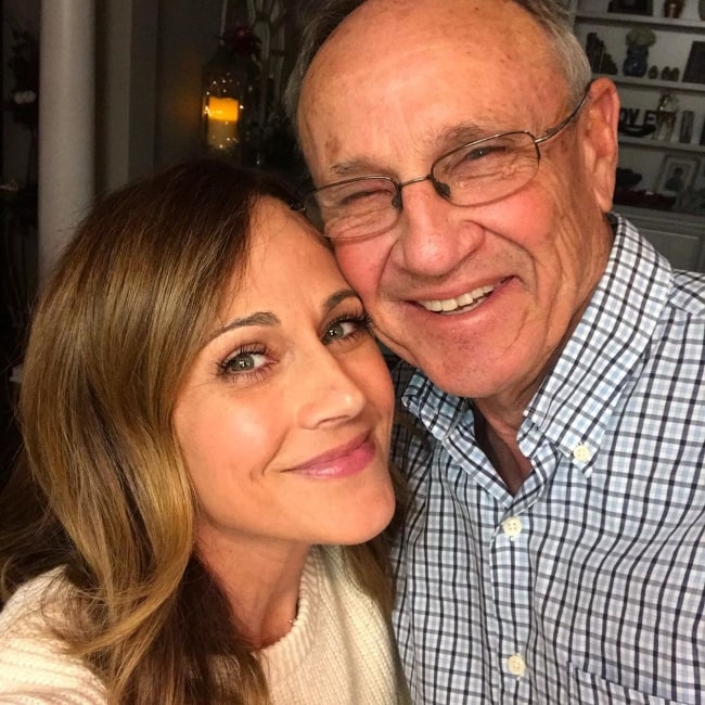 Nikki DeLoach as seen while smiling in a picture along with her father in Pierce County, Georgia, United States in June 2019