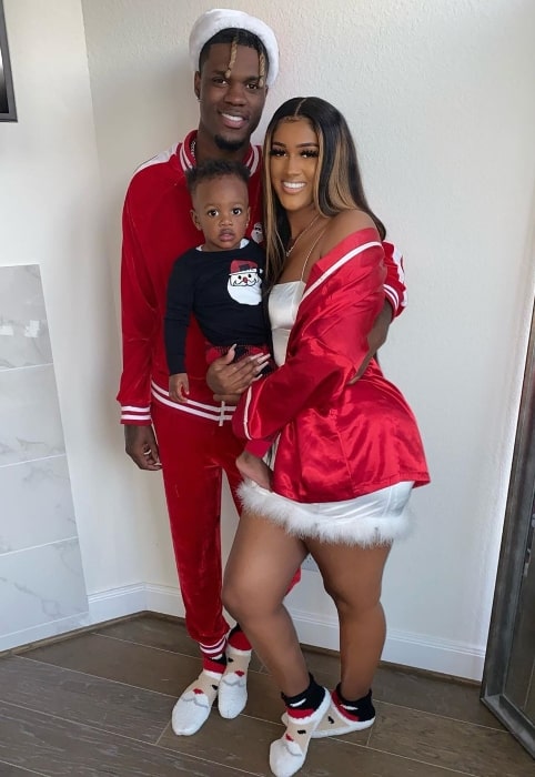 Nique Nique&King as seen while posing for a Christmas picture along with her family in December 2019