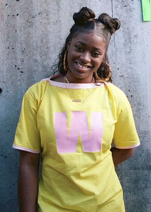 Tierra Whack as seen while smiling in a picture at the Museum of Modern Art PS1 in New York City, New York in 2018