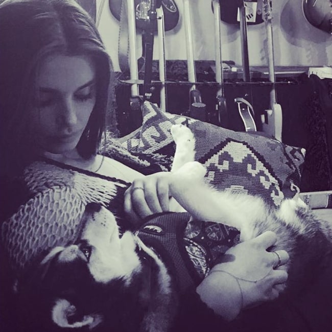 Aimee Osbourne as seen in a picture taken while she affectionately plays with a husky at Kingsize Soundlabs in December 2016