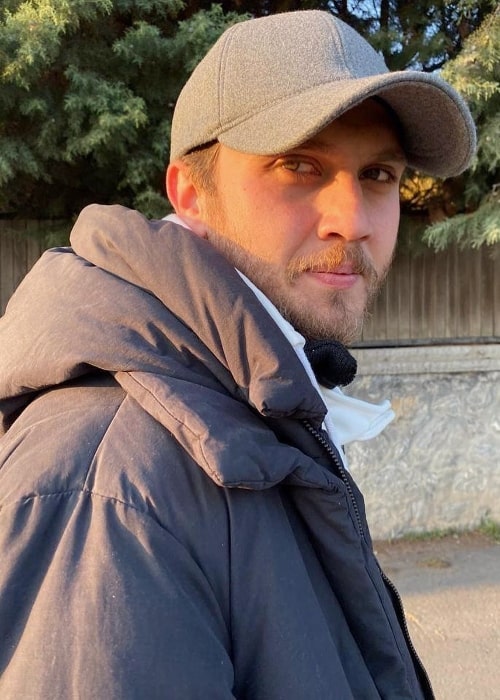 Aras Bulut İynemli as seen while smiling for the camera in December 2019