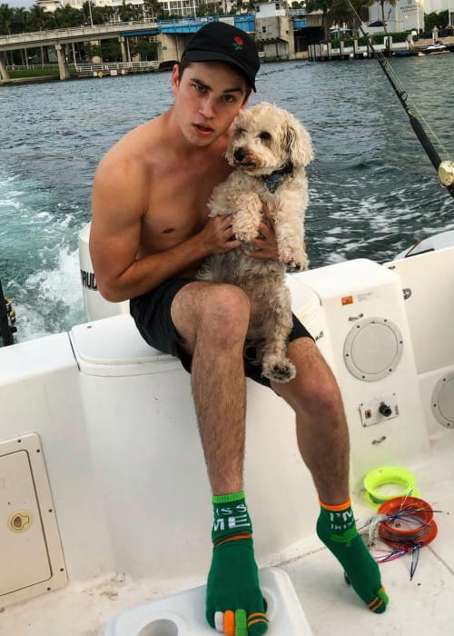 Carson Rowland with his dog as seen in March 2019