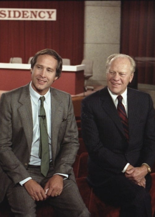 Chevy Chase (Left) and Gerald Ford sitting before the Conference on Humor and the Presidency held at the Gerald R. Ford Museum in 1986