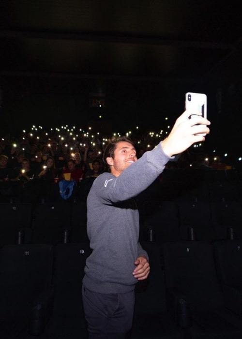 Dani Juncadella as seen in a picture taken while he was taking a selfie with the audience that had come to watch the film Le Mans '66 (In English Ford V Ferrari) in November 2019