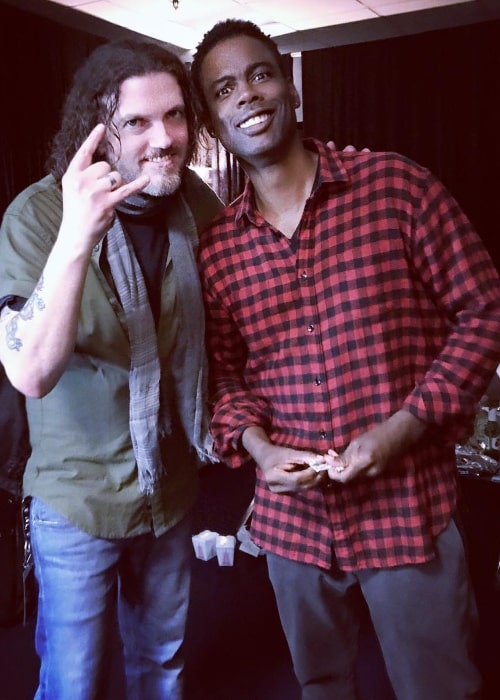 Dizzy Reed (Left) posing for a picture alongside Chris Rock in October 2017