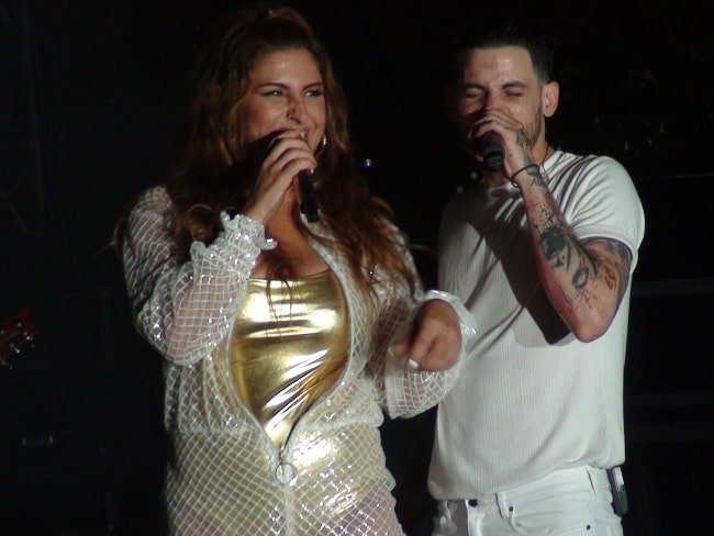 Elena Paparizou and Anastasios Rammos pictured while performing at the Ouranio Toxo Tour Live in 2018