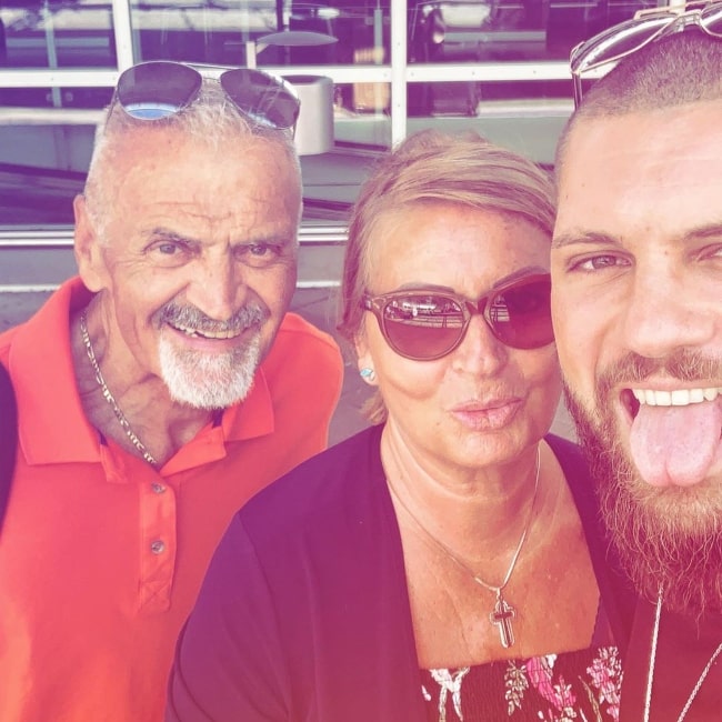 Florian Munteanu as seen in a selfie taken with his mother and father in September 2019