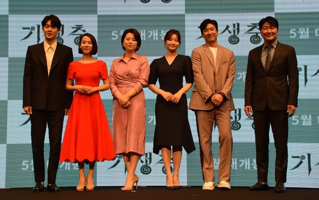 From left to right - Choi Woo-shik, Cho Yeo-jeong, Lee Jung-eun, Park So-dam, Lee Sun-kyun, and Song Kang-ho attending an event as the cast members of the film 'Parasite'