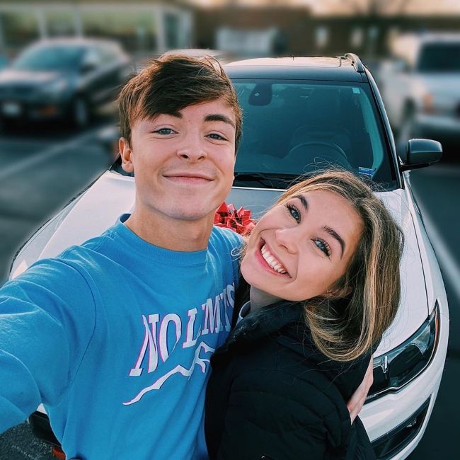 Gabrielle Moses posing with her boyfriend Jack Brinkman in December 2019