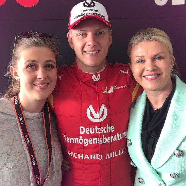 Gina Schumacher smiling in a picture along with her brother and their mother in January 2019