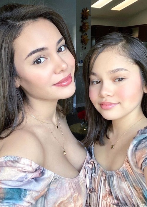 Ivana Alawi as seen while smiling in a picture along with her little sister, Mona Alawi, in Los Angeles, California in December 2019