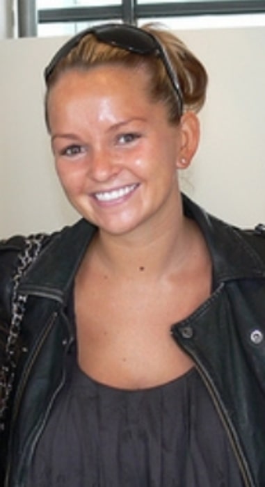 Jennifer Ellison smiling for the camera in June 2009