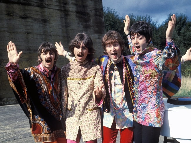 John Lennon (Third from the left) as seen in the press photo of 'The Beatles' during Magical Mystery Tour