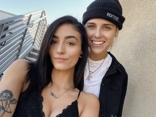 Karin DeStilo as seen while standing behind Skyler Felts and smiling for a selfie in November 2019