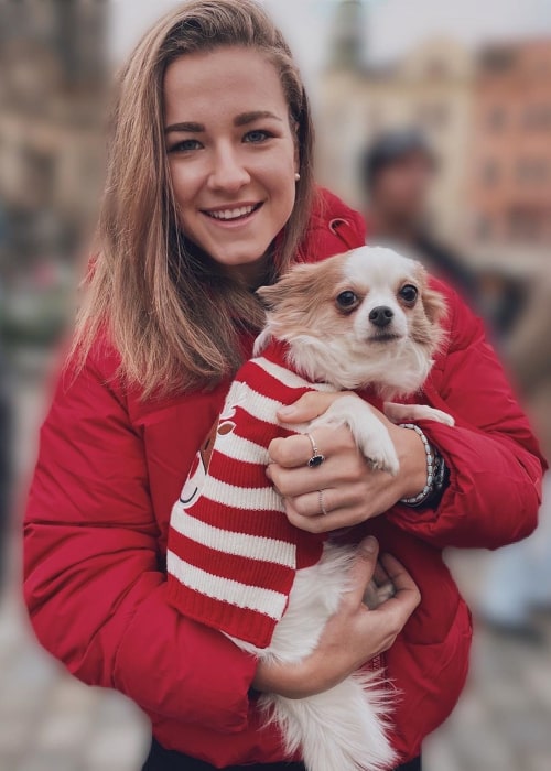 Karolína Muchová with her pet dog, as seen in December 2019
